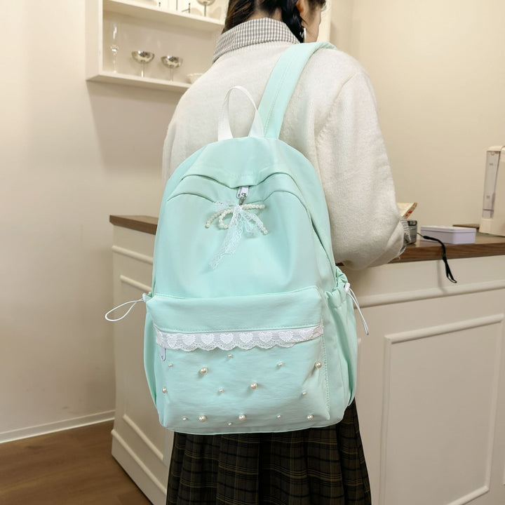Backpack with elegant pearl applications and intricate design Stornfield