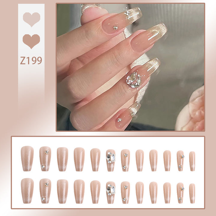 Acrylic nail set with glamorous glitter accents and elegant jewelry embellishments Stornfield