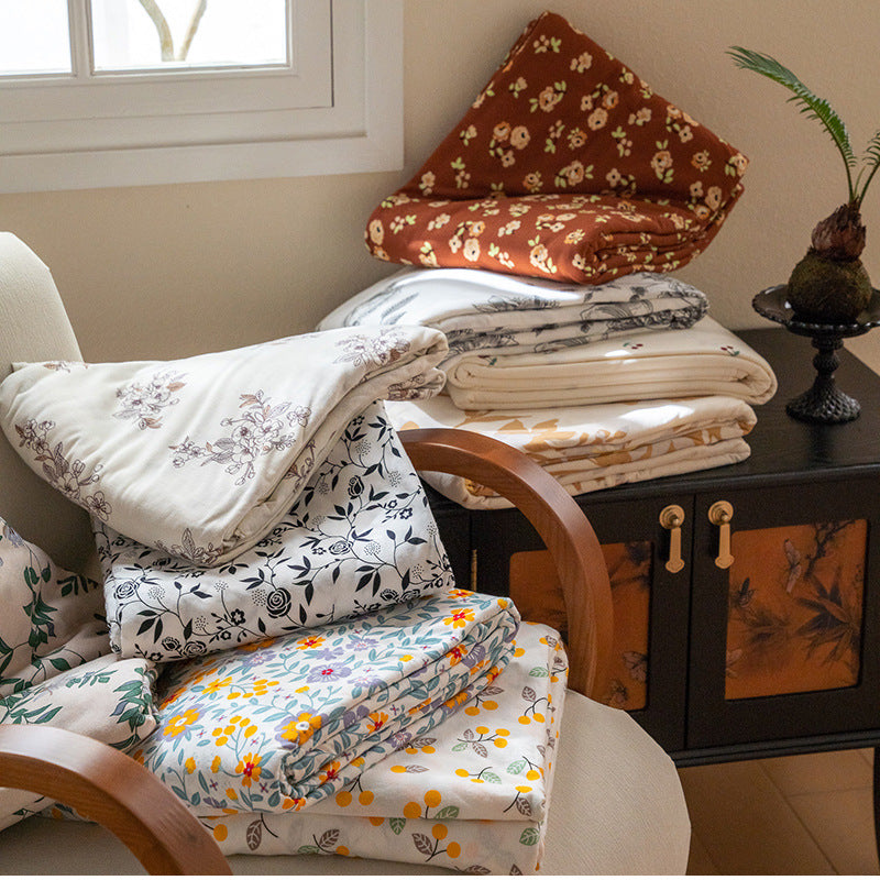 Organic Cotton Muslin Swaddle Blanket with Playful Cartoon Print