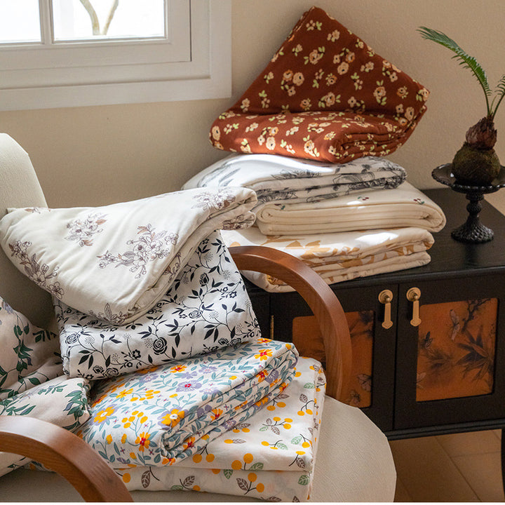 Organic Cotton Muslin Swaddle Blanket with Playful Cartoon Print