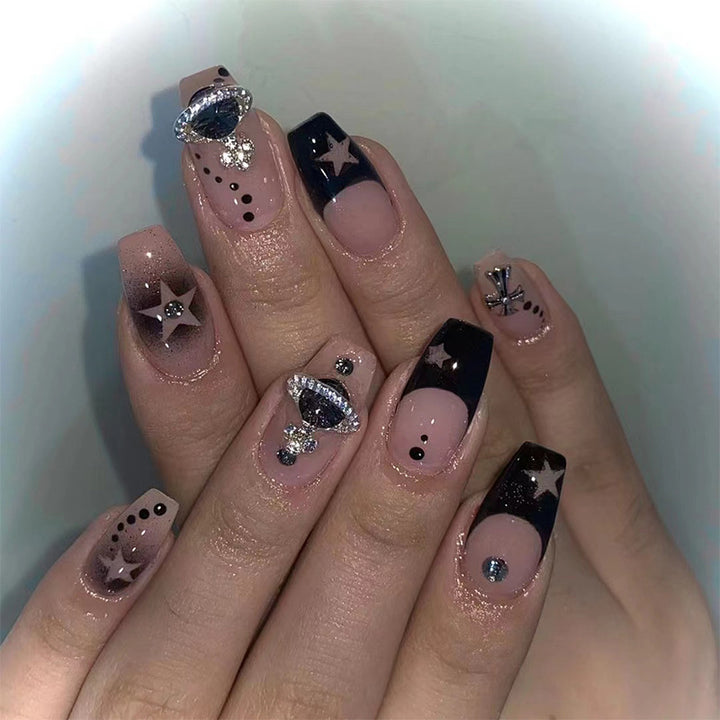 Glamorous nail art with star motifs and glitter accents Stornfield