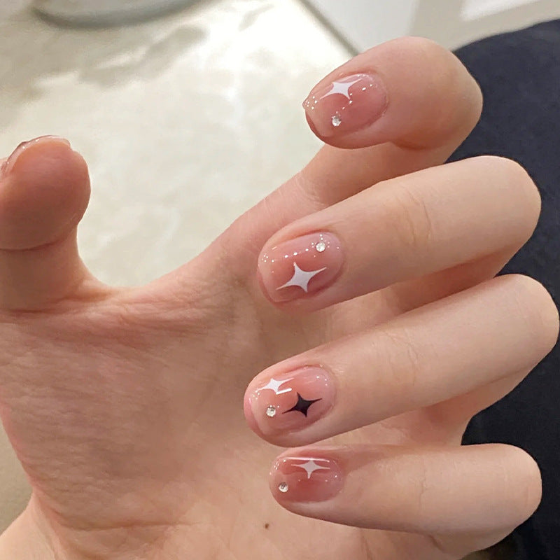 Acrylic nail set with sparkling star decorations and elegant accents Stornfield