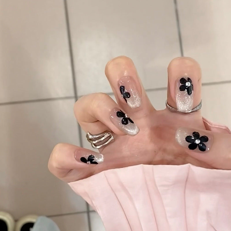 Artificial nail set with elegant flower design and glamorous accents Stornfield