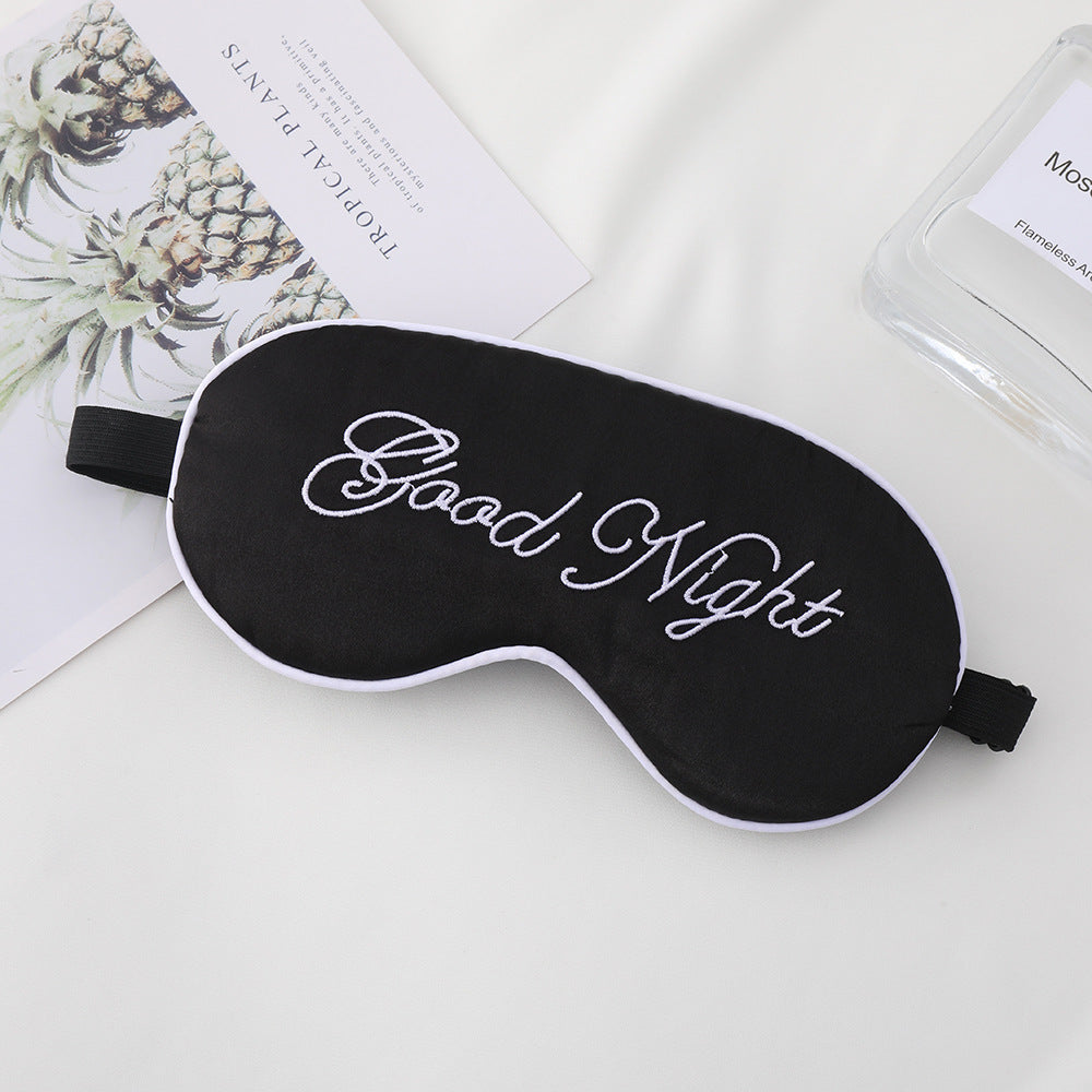 Unisex embroidered contoured sleep mask with decorative text embroidery and adjustable elastic band Stornfield