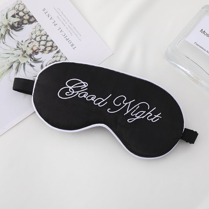 Unisex embroidered contoured sleep mask with decorative text embroidery and adjustable elastic band Stornfield