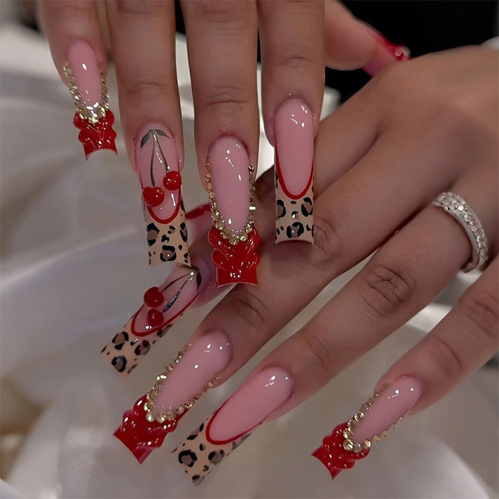 Glamorous artificial nail set with sparkling rhinestones and cross decorations Stornfield