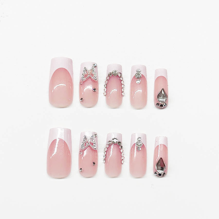 Acrylic nail set with elegant rhinestone and glitter decorations Stornfield
