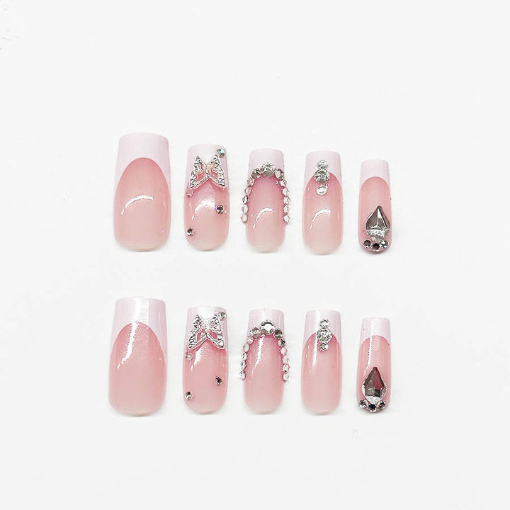 Acrylic nail set with elegant rhinestone and glitter decorations Stornfield
