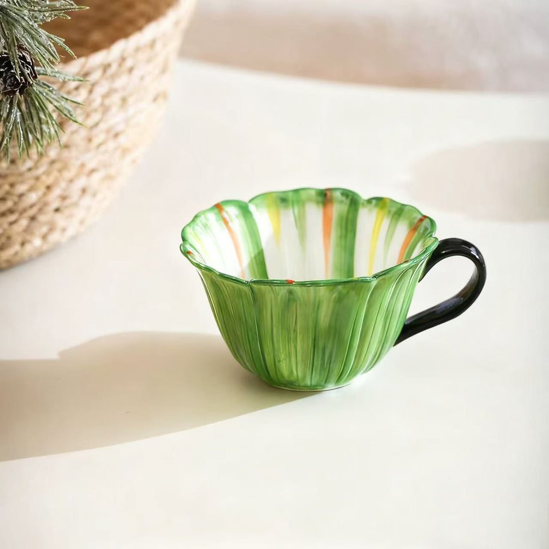 Handcrafted ceramic mug with shell-shaped wave edge and contrasting handle