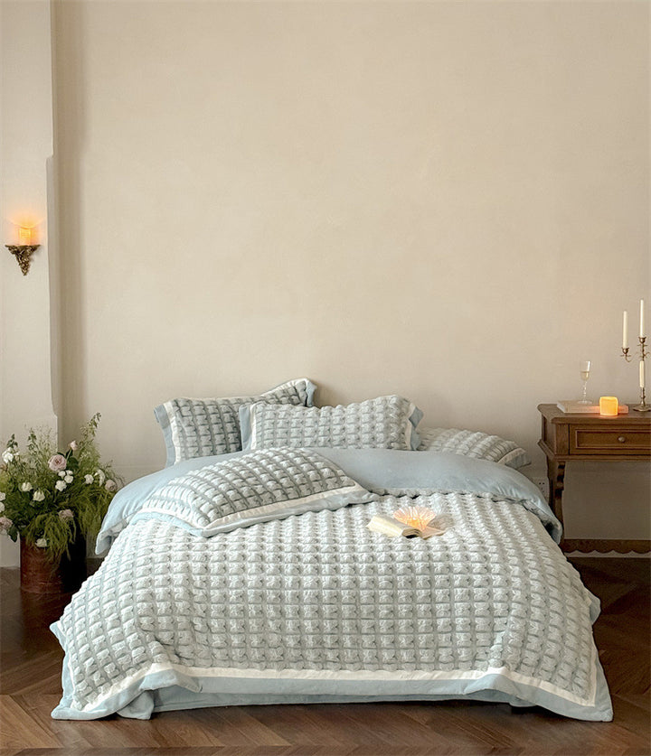 Quilted velvet bedding set with 3D waffle structure and decorative border Stornfield