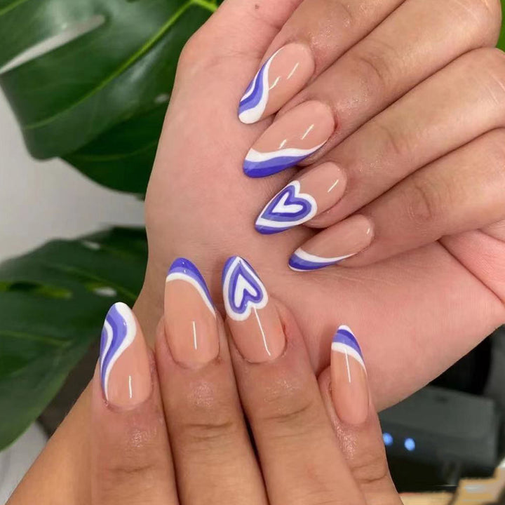 Artful nail extensions with an elegant leaf pattern Stornfield