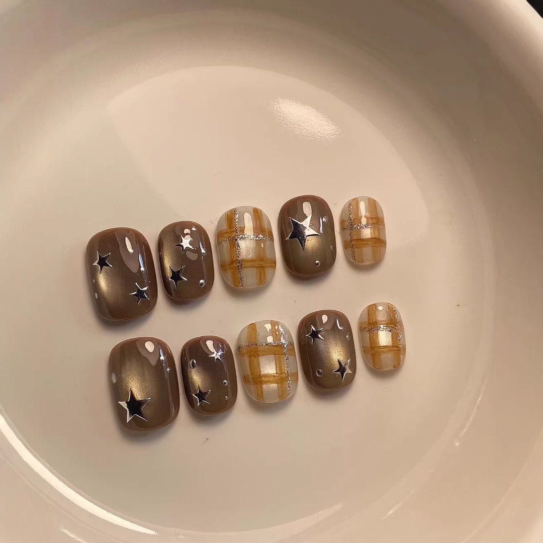 Artistic Nail Art Set with Unique Star and Plaid Designs