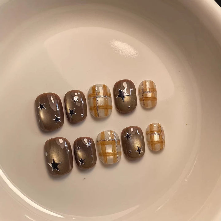 Artistic Nail Art Set with Unique Star and Plaid Designs