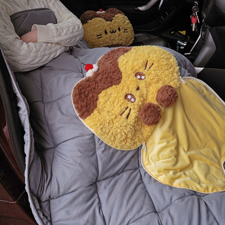 Cuddle set made of plush cat cushion and quilted travel blanket with zipper storage