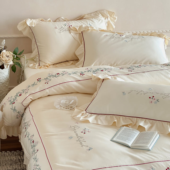 Luxurious bedding set with ruffled hem and floral embroidery