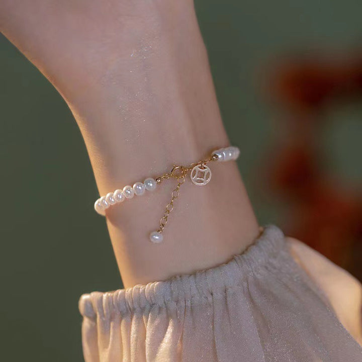 Elegant Pearl Charm Bracelet Stornfield