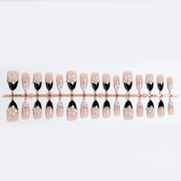Artful nail tips with floral embellishments Stornfield