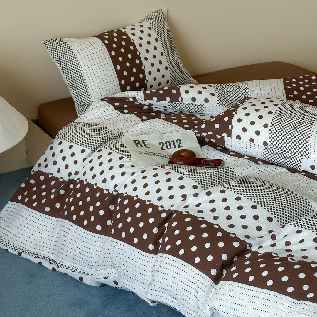 Reversible cotton percale bedding set with patched dot pattern and breathable quilted texture