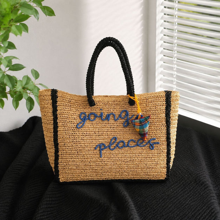 Leisure bag made of woven natural material with colorful pendant Stornfield