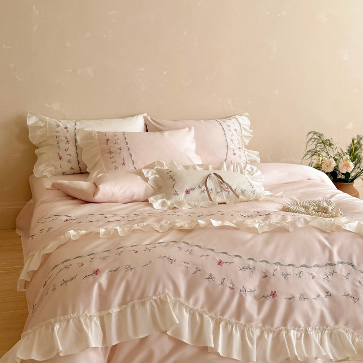 Romantic bedding set with ruffles and floral embroidered cotton satin