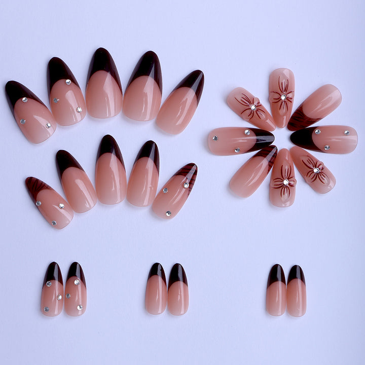 Artificial nails with elegant flower design and glitter accents Stornfield