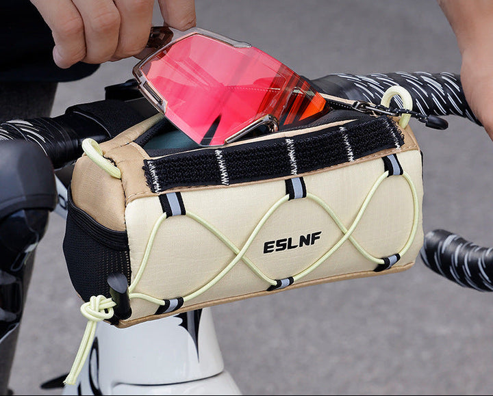 compact cylindrical handlebar bag with elastic bungee and universal Velcro mount Stornfield