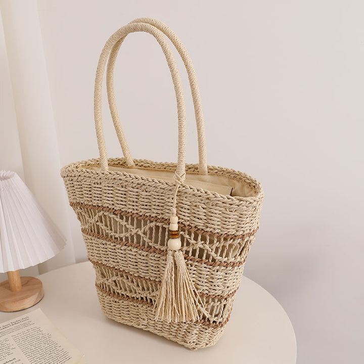 Handcrafted straw tote bag with decorative tassel detail Stornfield
