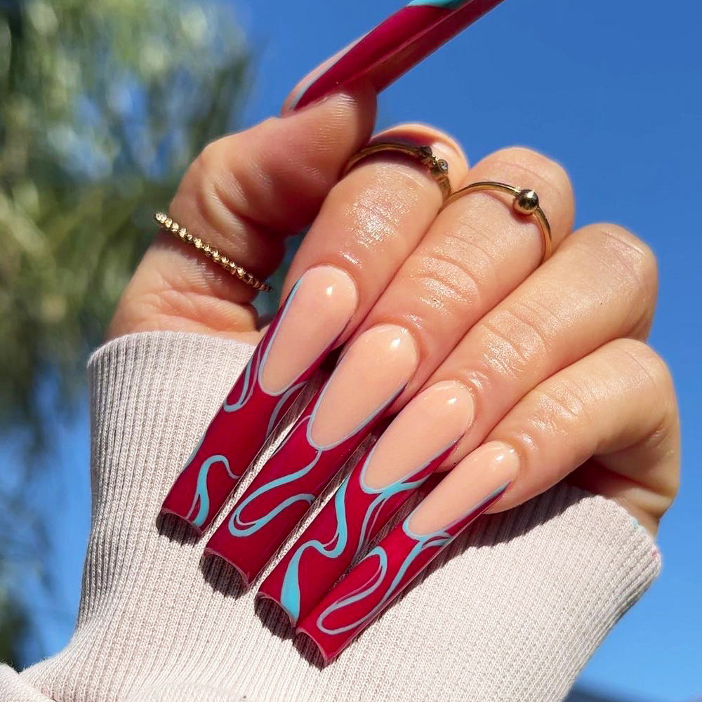 Artistic acrylic nails with floral and graphic accents Stornfield