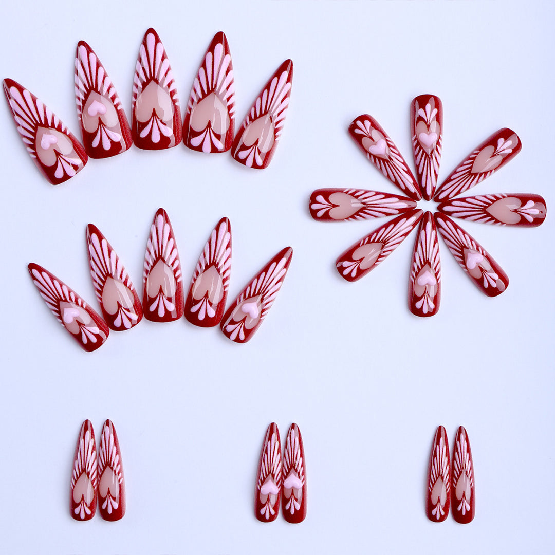 Artificial nails with playful heart design and elegant accents Stornfield