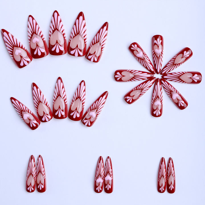 Artificial nails with playful heart design and elegant accents Stornfield