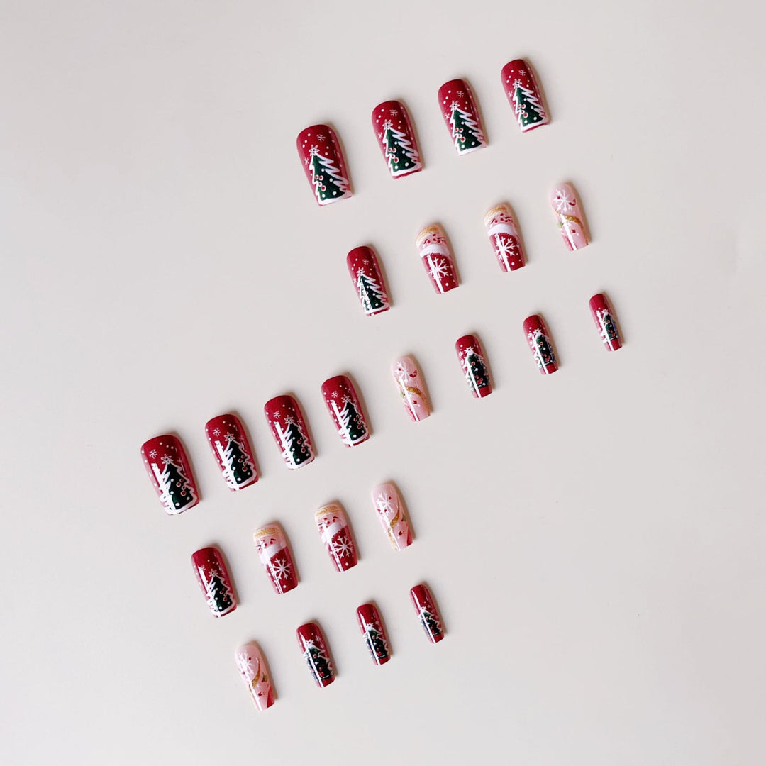 Artificial nail set with festive Christmas designs and glitter accents Stornfield