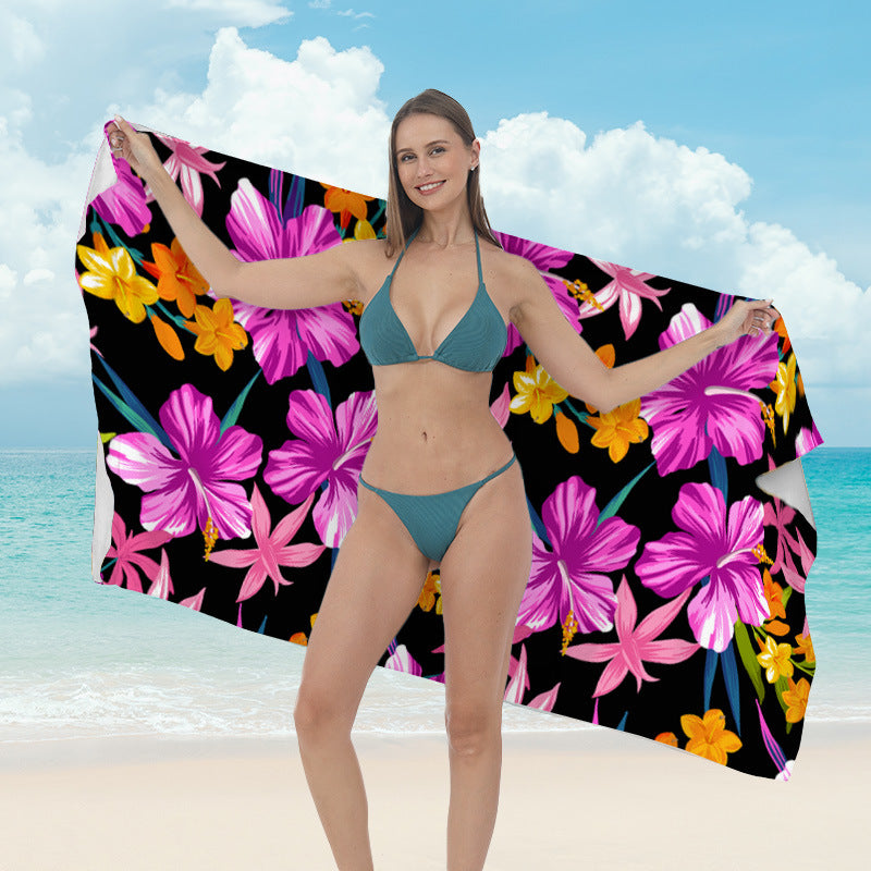 Beach towel with vibrant tropical plant motif Stornfield