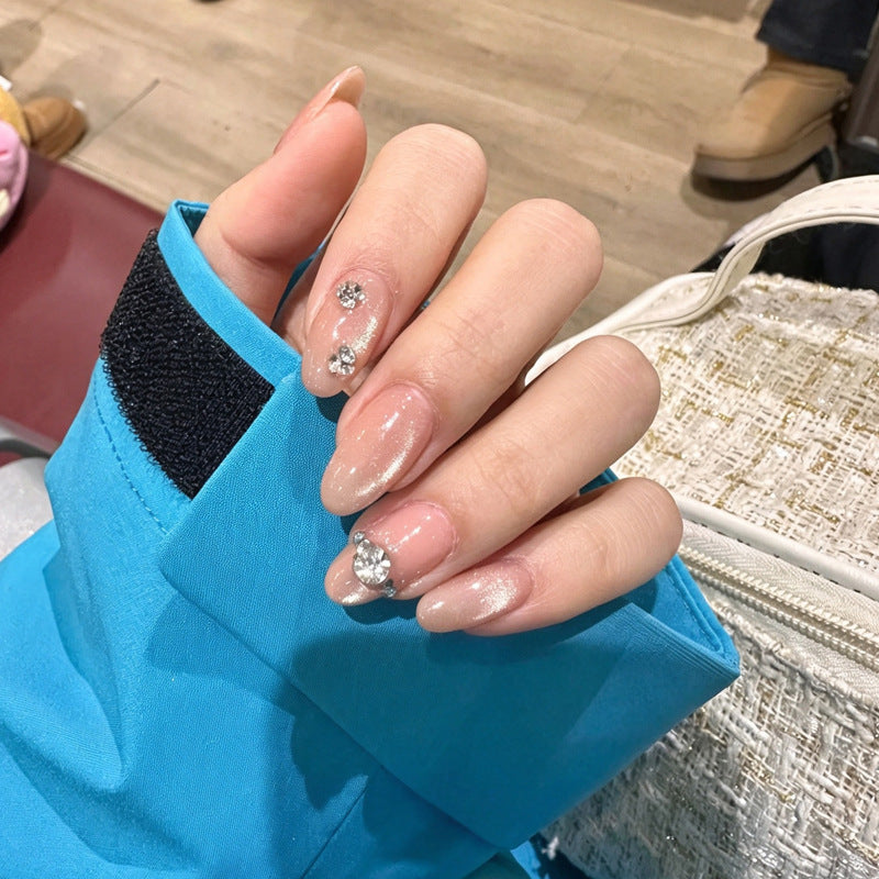 Artificial nail set with elegant rhinestone embellishments Stornfield