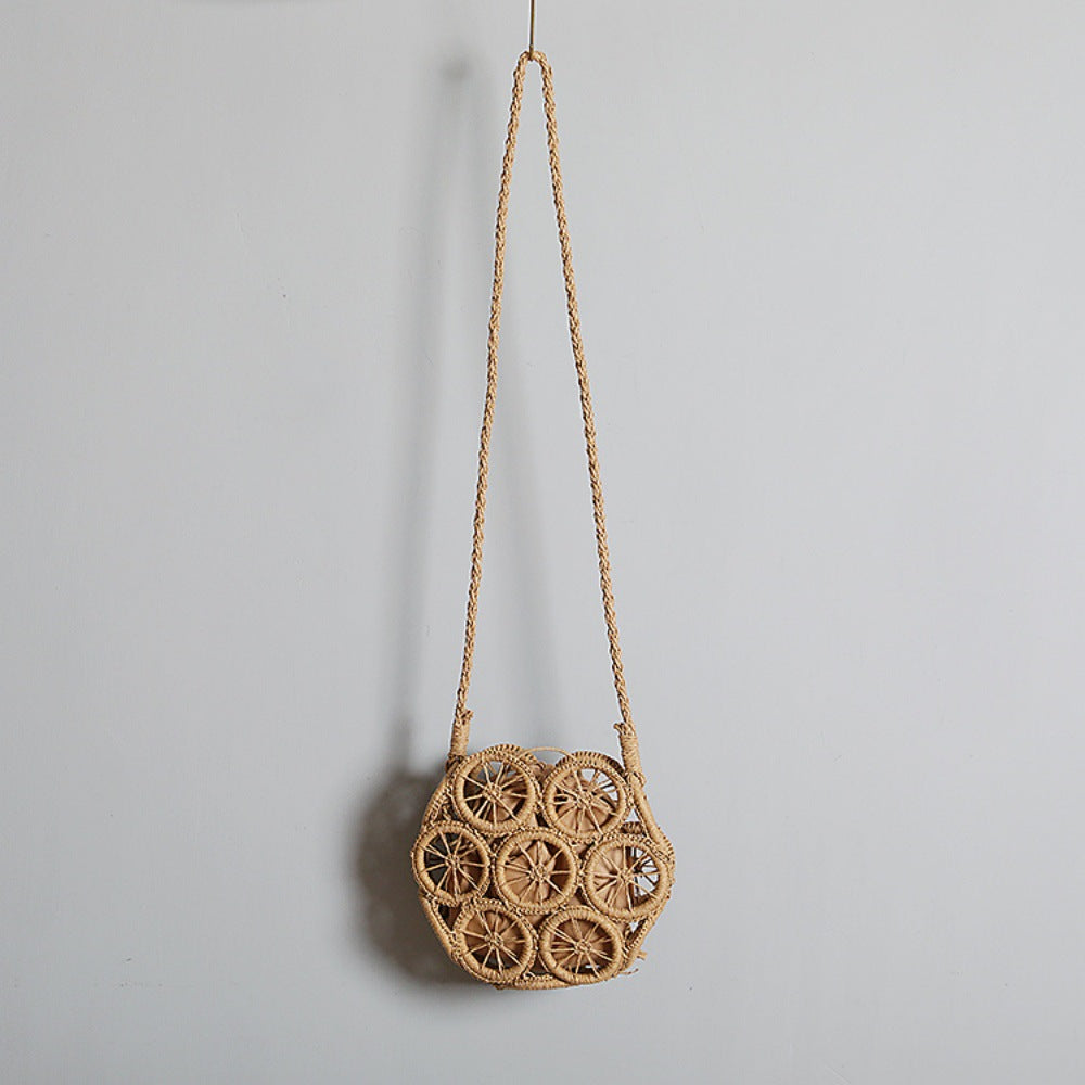 Shoulder bag made of handwoven raffia with intricate embellishments Stornfield