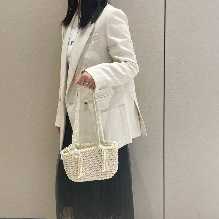 Hand-knotted shoulder bag with decorative pleating technique Stornfield