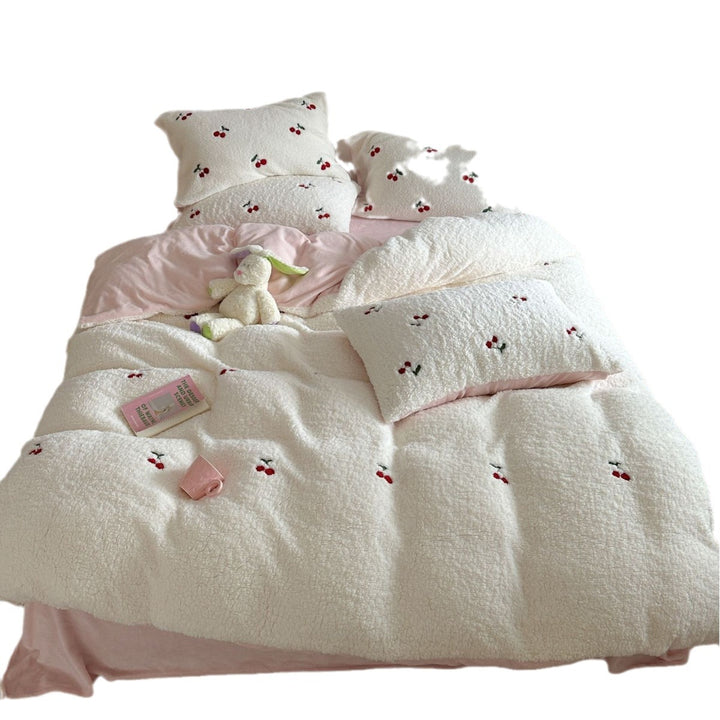 Cozy Sherpa blanket with embroidered teddy and cake motifs