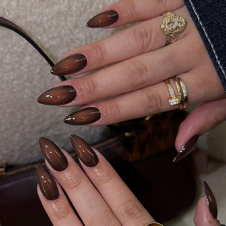 Acrylic nail set with luxurious color gradient and elegant lace accent Stornfield