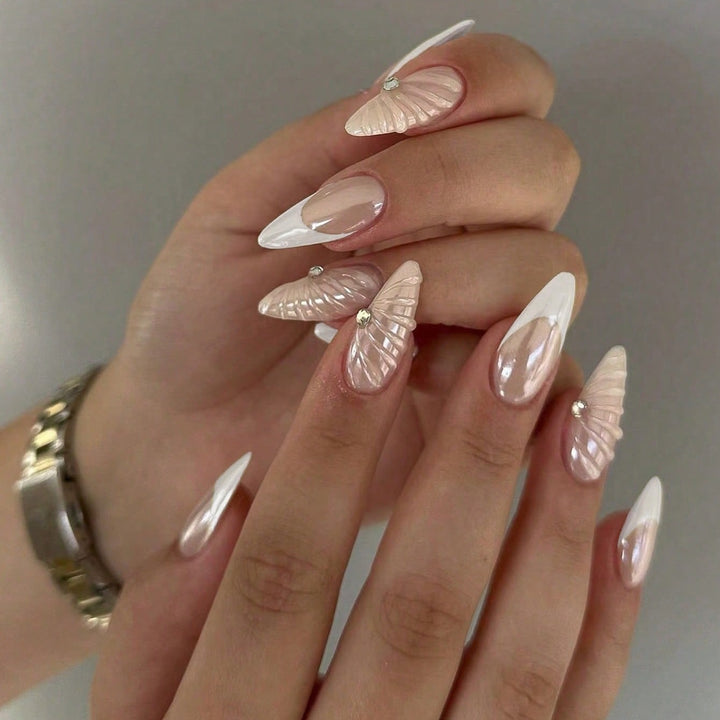 Artificial nail set with elegant shell pattern and glitter accents Stornfield