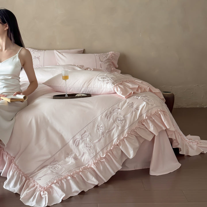 Luxurious embroidered bedding set with ruffle and pillowcases