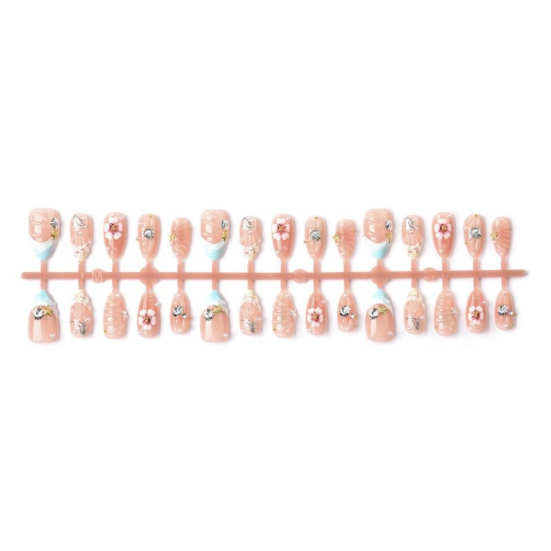 Acrylic nail set with filigree shell and flower decorations Stornfield
