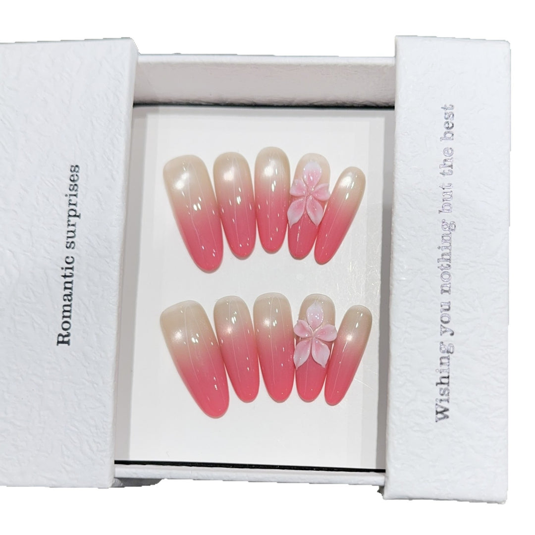 Artificial nails with romantic ombre design and floral accents Stornfield