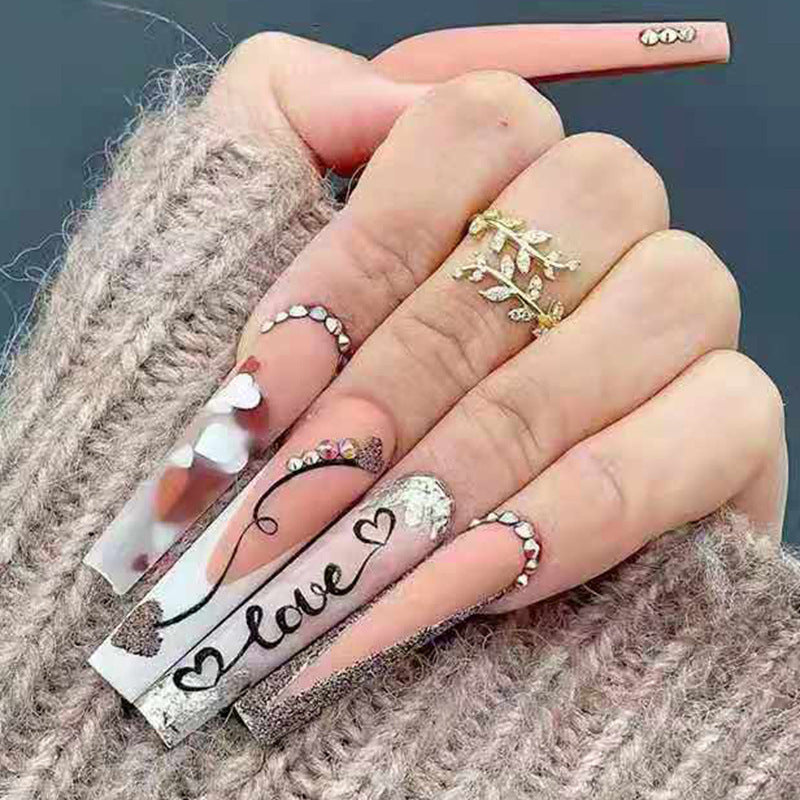 Acrylic nail set with romantic heart and glitter decorations Stornfield