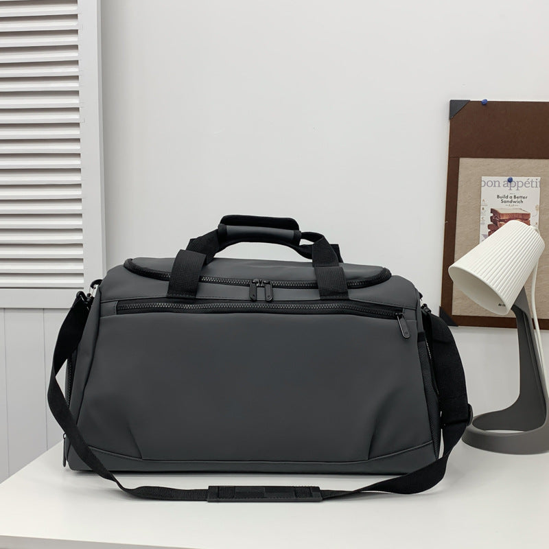 Sporty travel bag with reinforced carrying handles and multiple compartments Stornfield