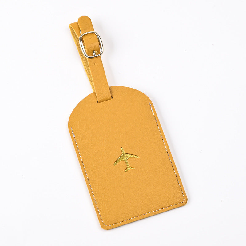 premium leather luggage tag with adjustable buckle strap and embossed airplane Stornfield
