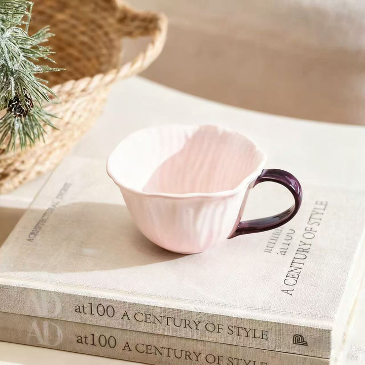 Ceramic mug with saucer in flower shape