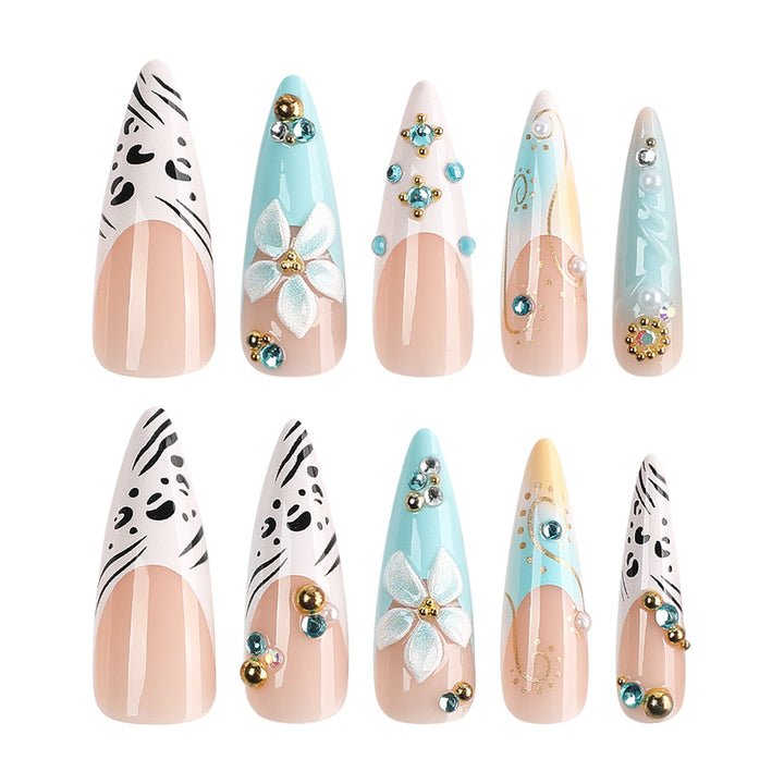 Artistic stiletto nails with floral accents and glitter details Stornfield