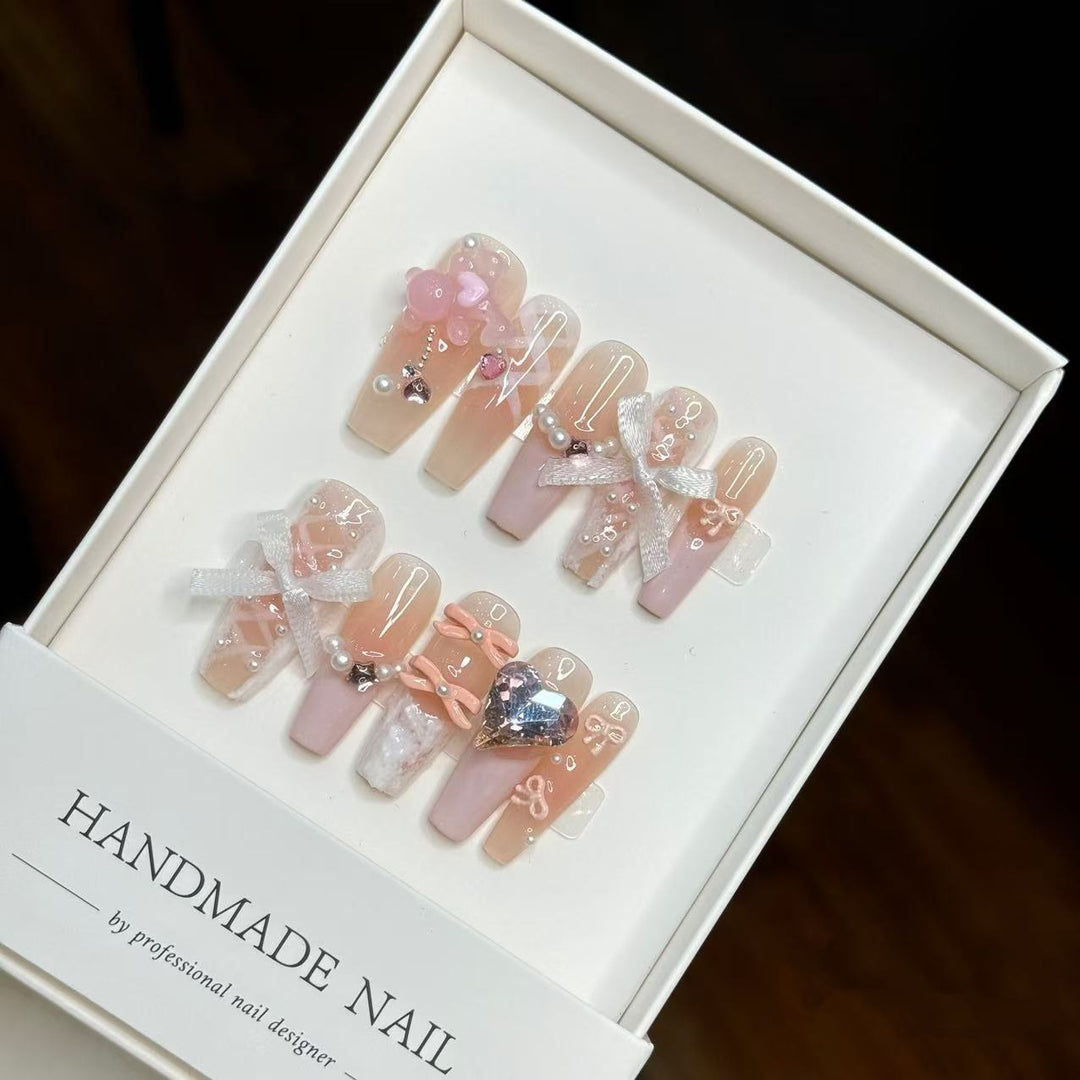 Artistic Press-On Nail Set with Decorative Bow and Gem Accents