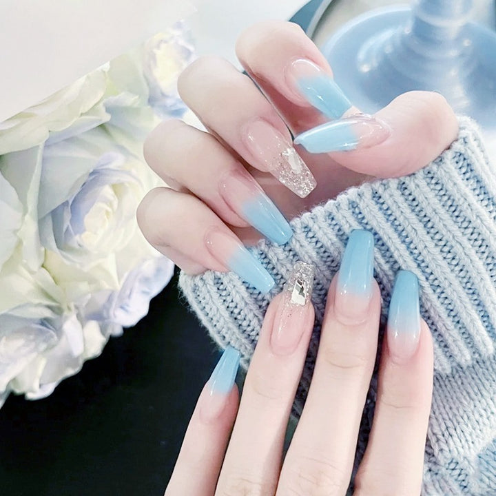 Nail set with elegant ombre and glitter accents Stornfield