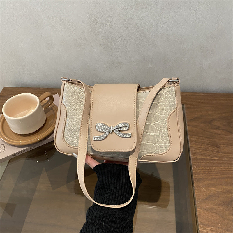 Elegant Crocodile-Patterned Handbag with Bow Detail