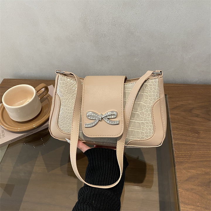 Elegant Crocodile-Patterned Handbag with Bow Detail